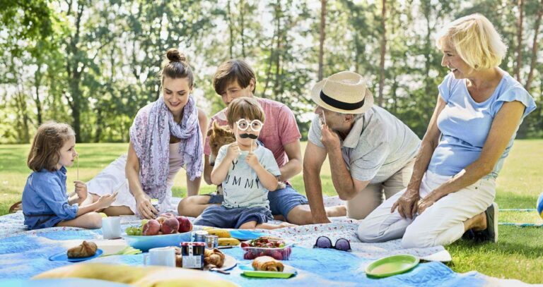 A three-generation family at a picnic