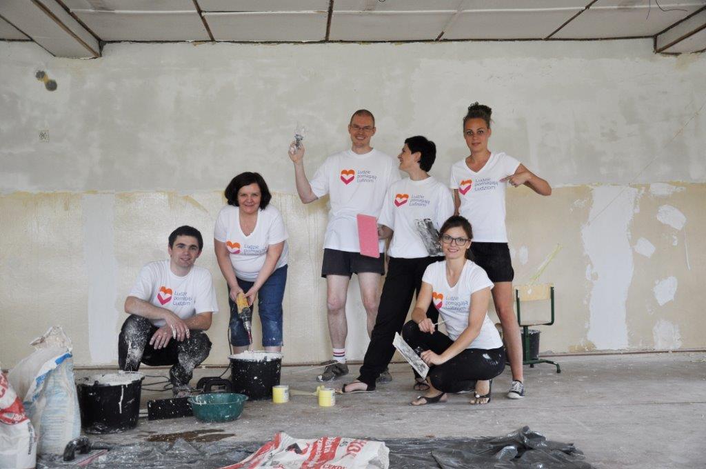 A group of volunteers in a renovated building